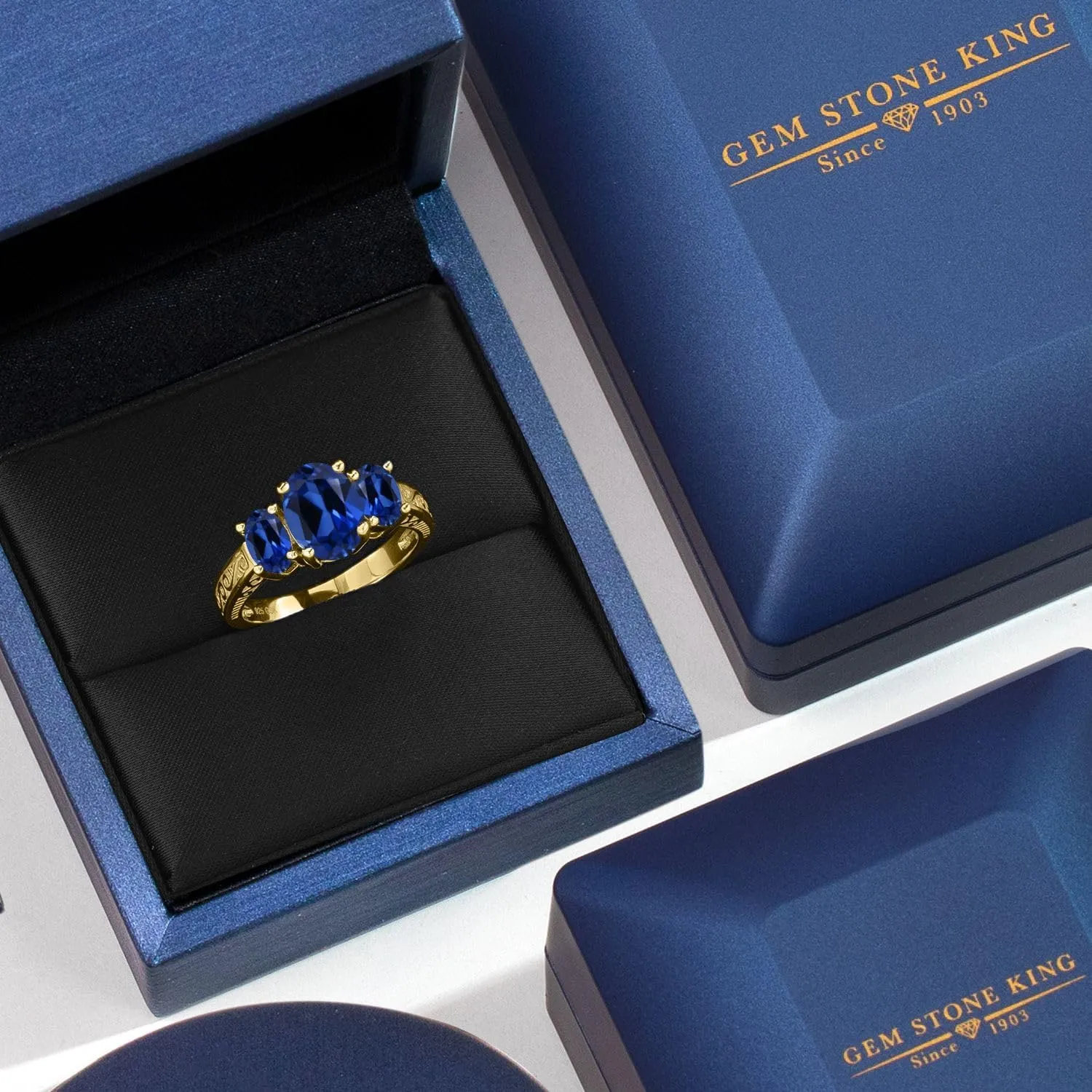 Gem Stone King 18K Yellow Gold Plated Silver Blue Created Sapphire 3-Stone Ring For Women (3.51 Cttw, Oval 9X7MM and 6X4MM, Available 5,6,7,8,9)