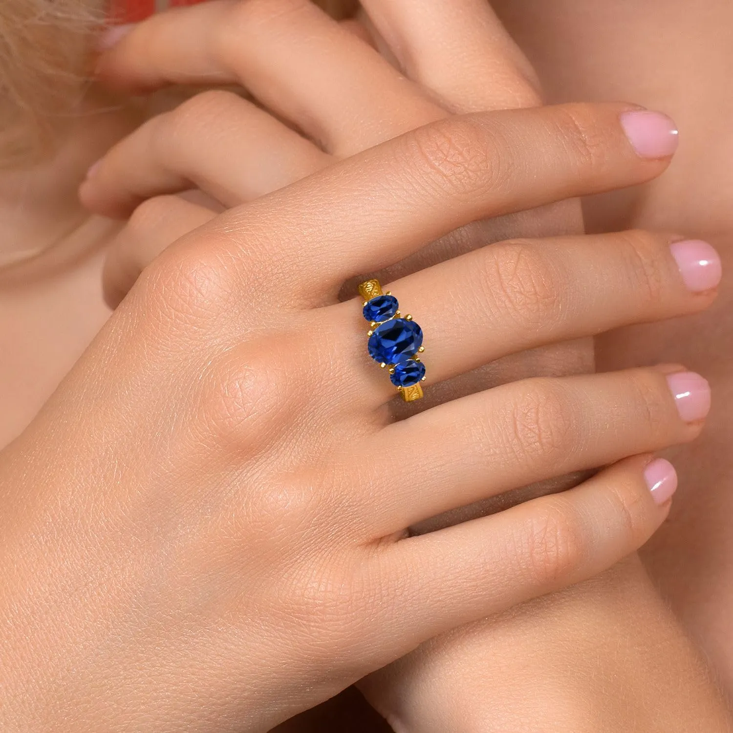Gem Stone King 18K Yellow Gold Plated Silver Blue Created Sapphire 3-Stone Ring For Women (3.51 Cttw, Oval 9X7MM and 6X4MM, Available 5,6,7,8,9)